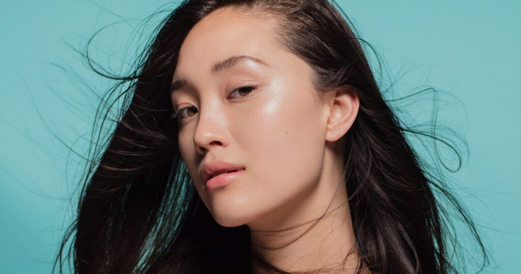 a woman with smooth, radiant skin and natural makeup.